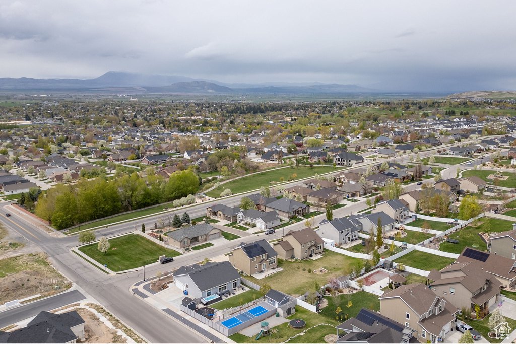 Birds eye view of property featuring a mountain view and a residential view