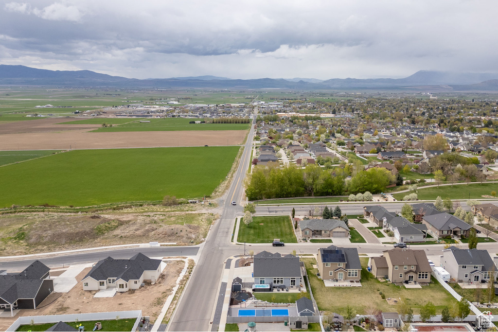 Birds eye view of property with a residential view and a mountain view