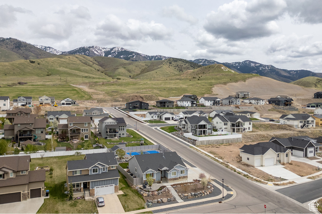Drone / aerial view featuring a mountain view and a residential view