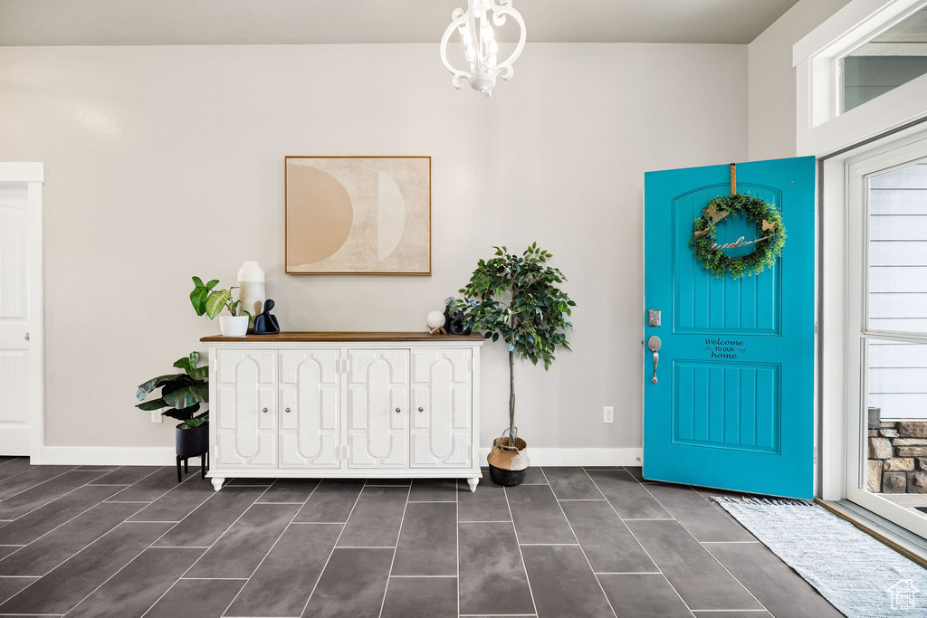 Foyer with baseboards and a wealth of natural light