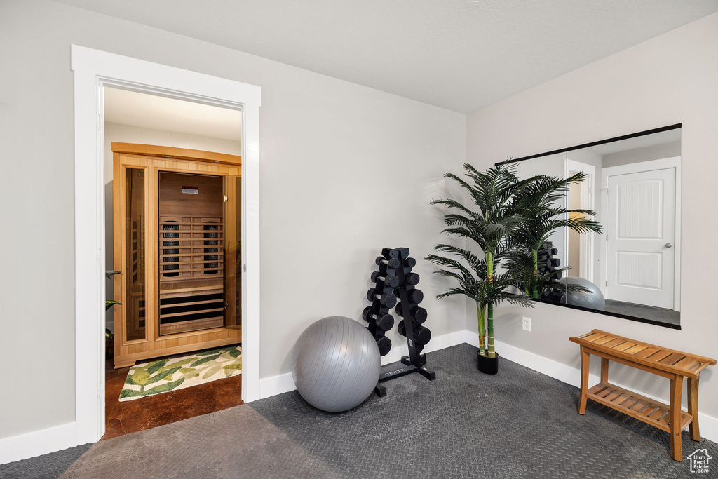 Exercise area with baseboards and beverage cooler