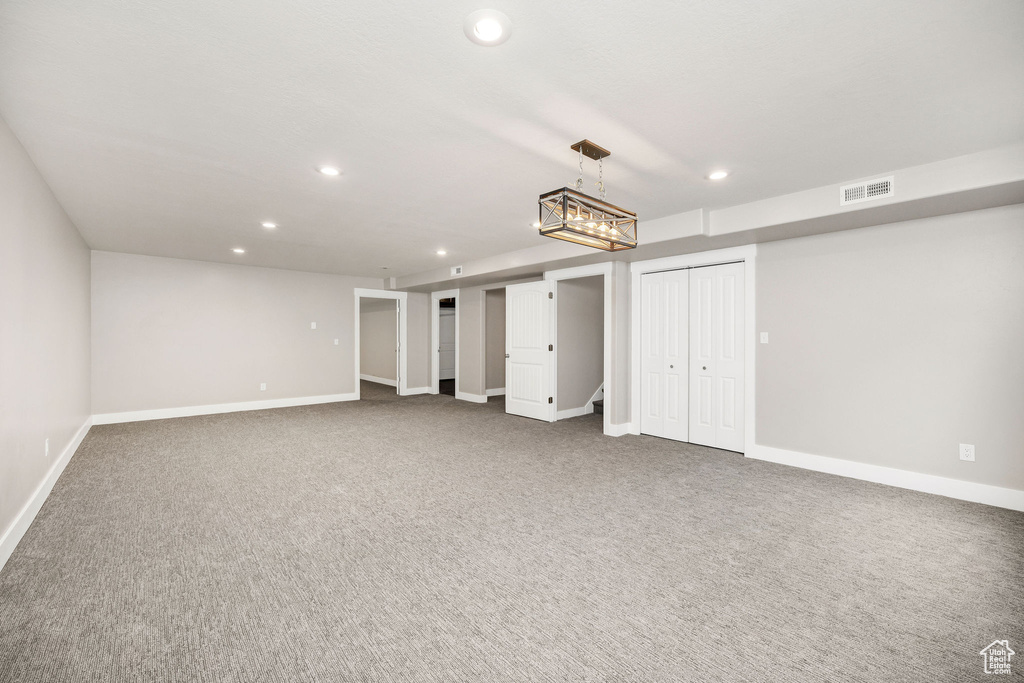 Finished basement featuring recessed lighting, baseboards, visible vents, and carpet