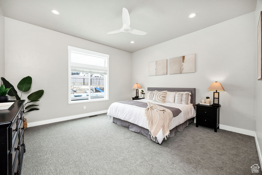 Bedroom with carpet flooring, ceiling fan, recessed lighting, baseboards, and visible vents