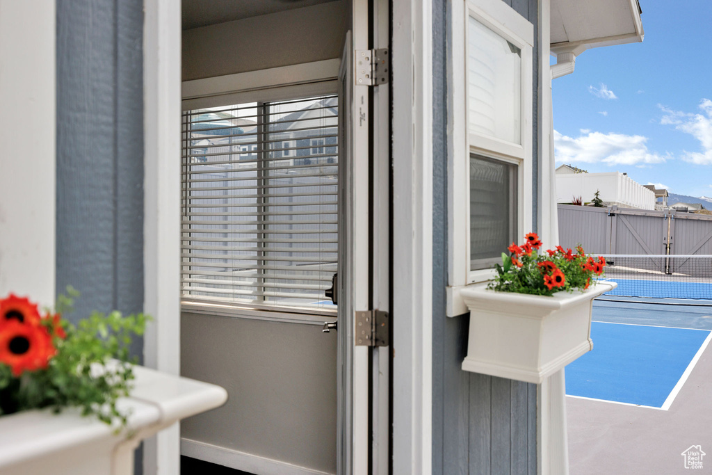 Doorway to outside with baseboards