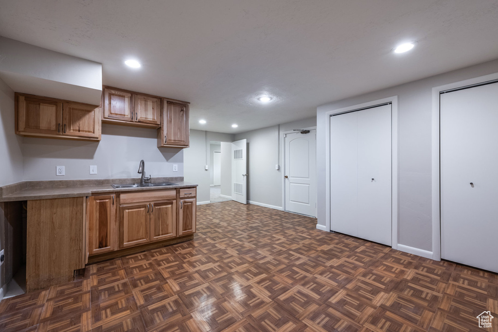 Kitchen with recessed lighting, a sink, and brown cabinets