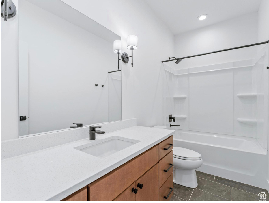Bathroom with vanity, bathing tub / shower combination, toilet, recessed lighting, and tile patterned floors