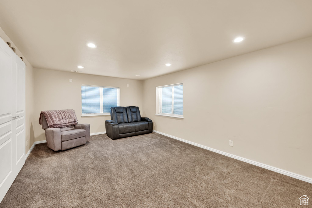Sitting room featuring recessed lighting, baseboards, and carpet