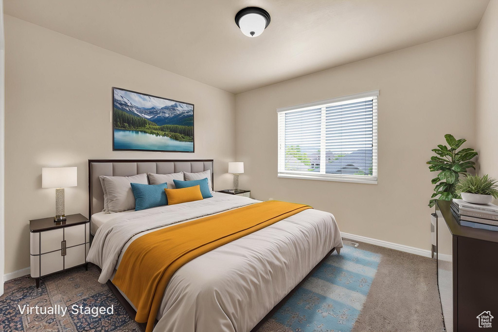 Carpeted bedroom featuring baseboards
