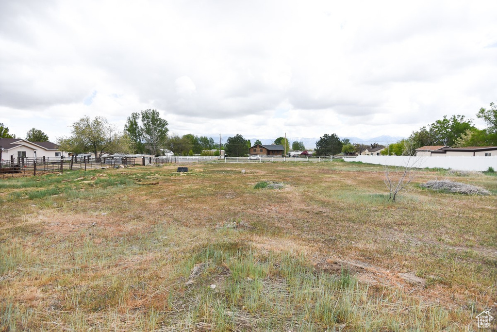 View of yard featuring fence
