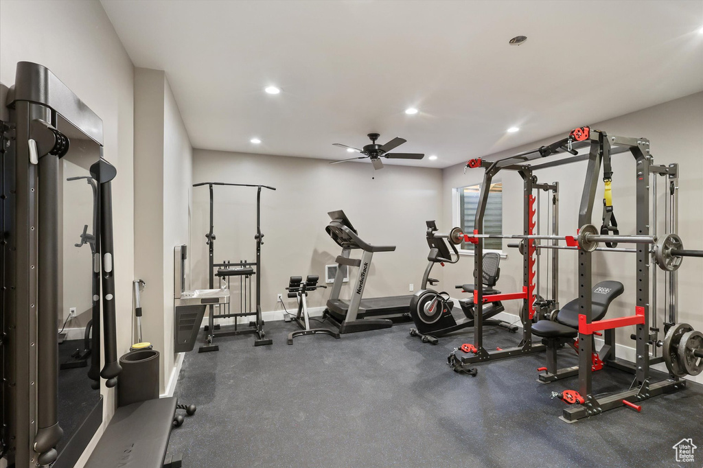 Exercise room featuring recessed lighting, baseboards, and ceiling fan