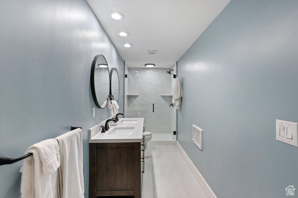 Bathroom with visible vents, vanity, toilet, recessed lighting, and a shower stall