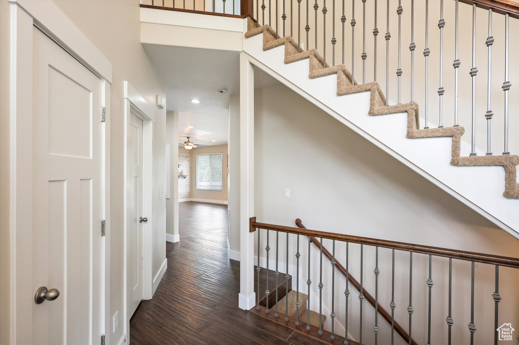 Hall with recessed lighting, baseboards, and hardwood / wood-style flooring