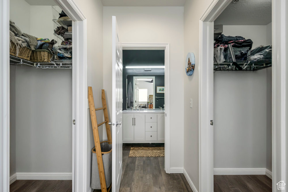 Hallway featuring dark wood-style flooring
