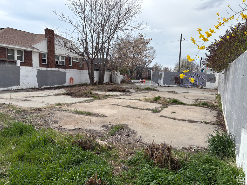 View of yard featuring fence