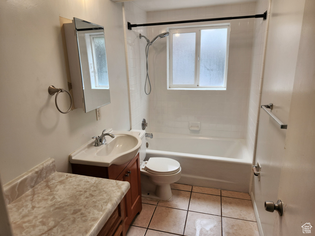 Full bath featuring tub / shower combination, toilet, tile patterned floors, and vanity