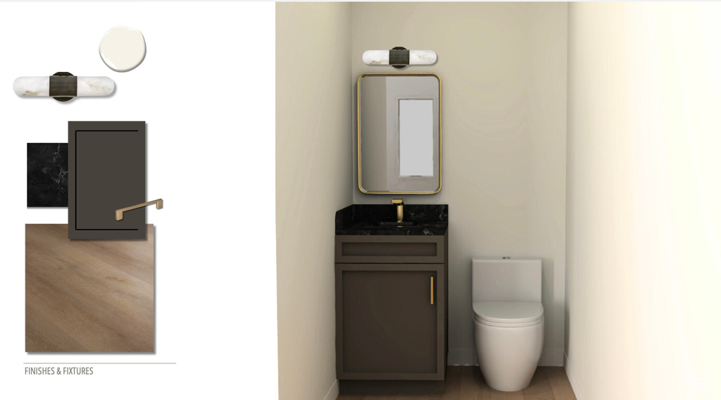Bathroom with vanity, wood finished floors, and toilet