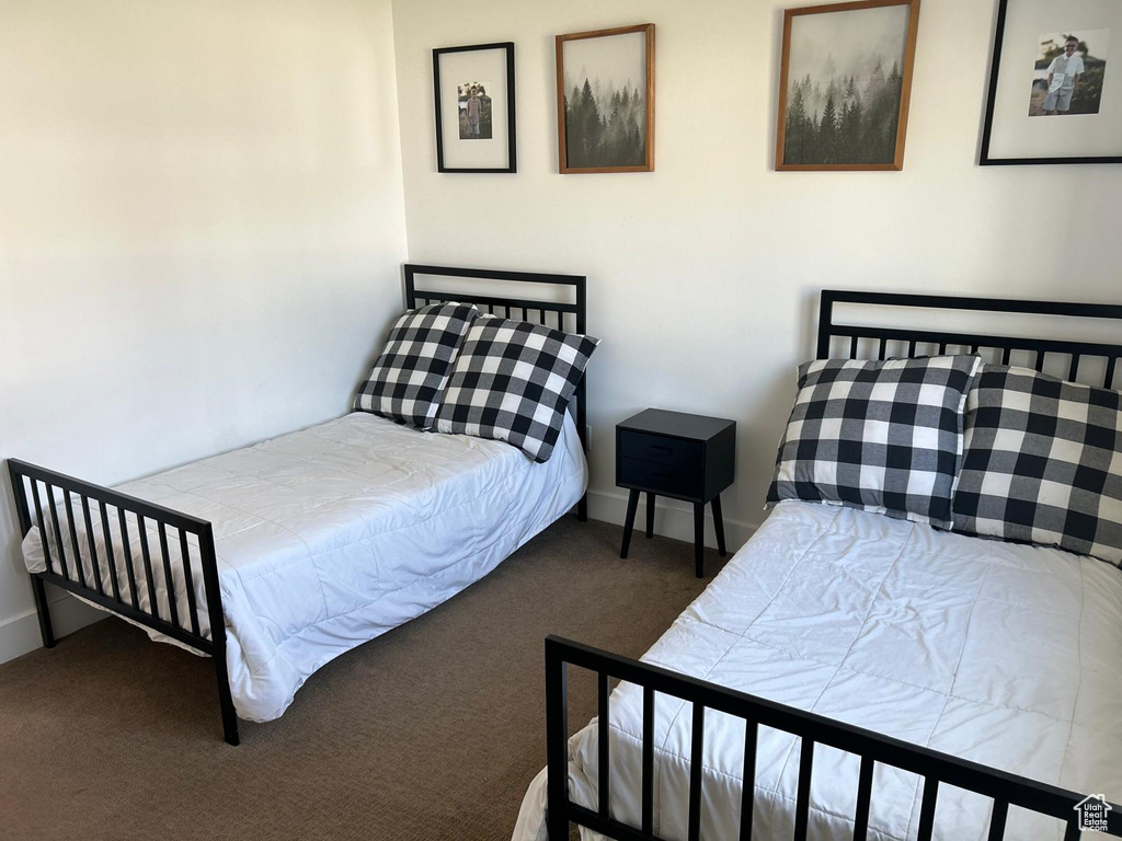 Carpeted bedroom with baseboards