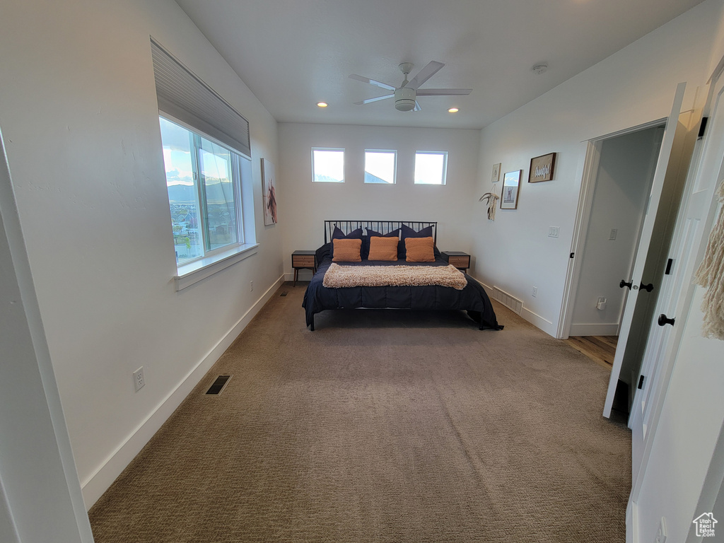 Bedroom with ceiling fan, visible vents, baseboards, carpet flooring, and recessed lighting