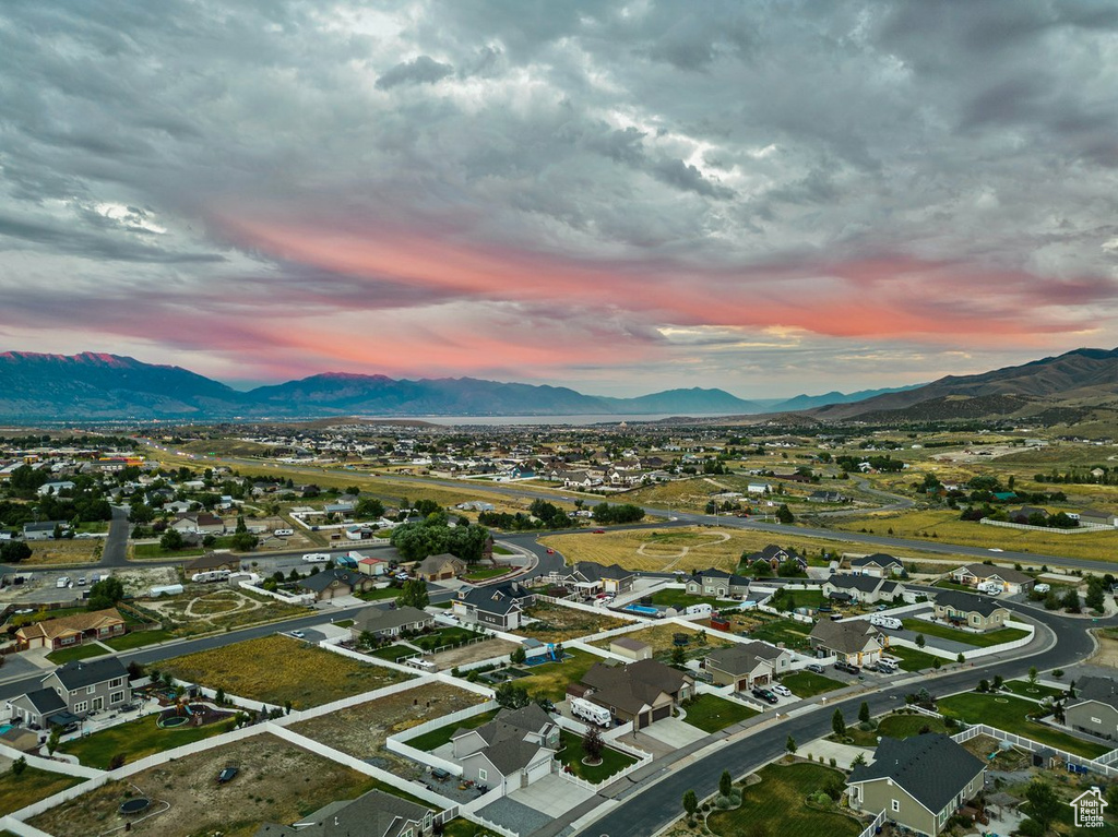 Aerial view at dusk featuring a residential view and a mountain view
