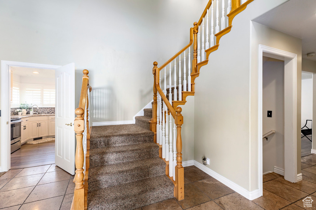 Stairway featuring baseboards