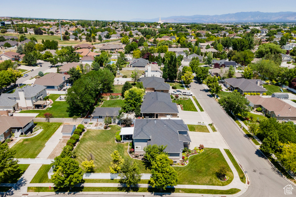 Aerial perspective of suburban area with a mountain backdrop