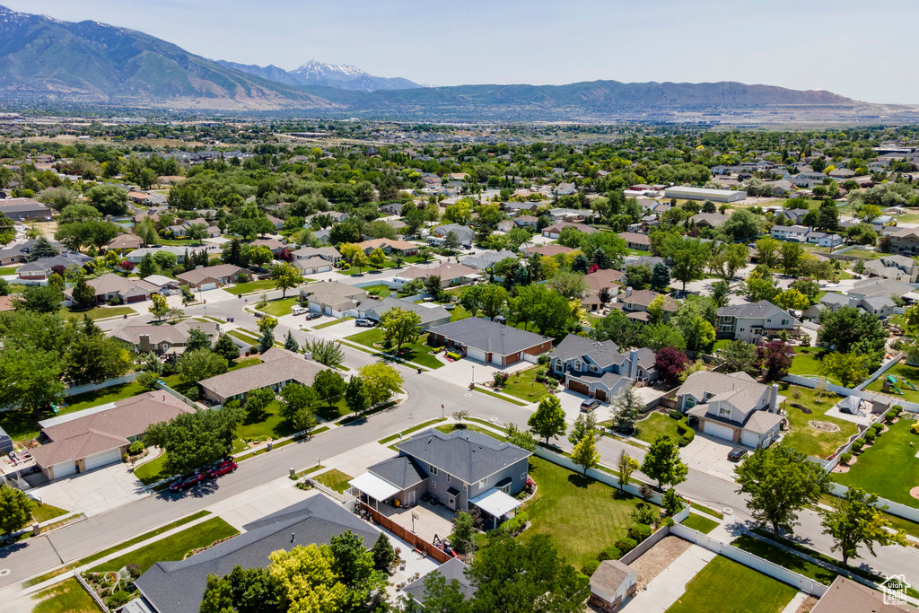 Aerial perspective of suburban area featuring a mountainous background