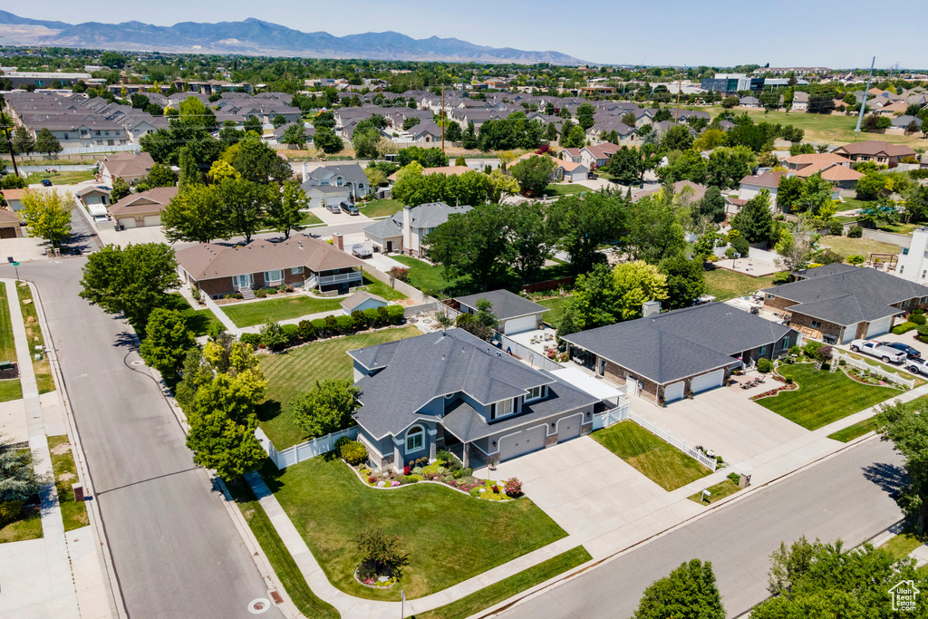 Aerial perspective of suburban area featuring a mountain backdrop