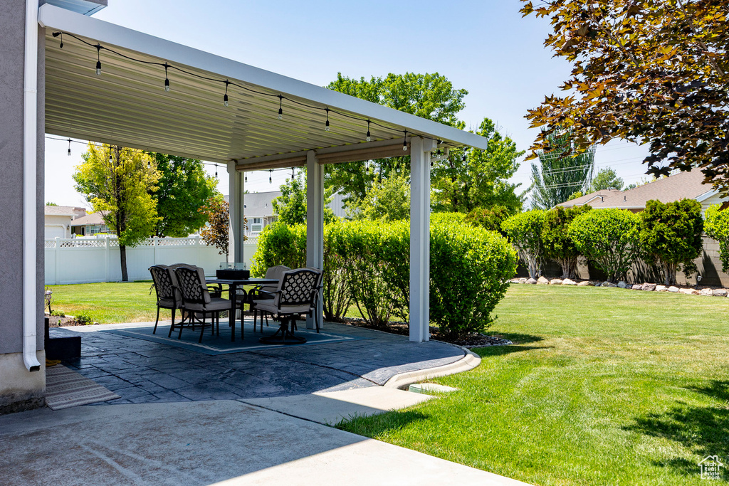 View of patio with outdoor dining area