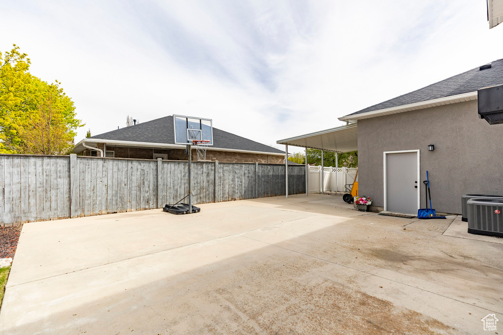 View of patio / terrace featuring cooling unit and a fenced backyard