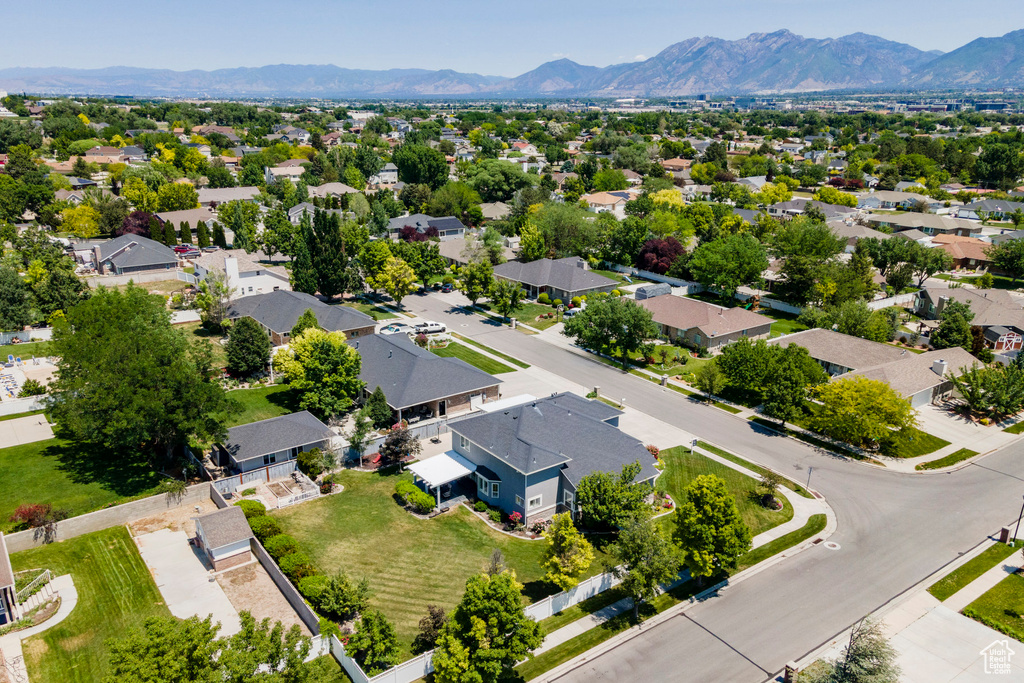 Aerial view of residential area featuring a mountain backdrop