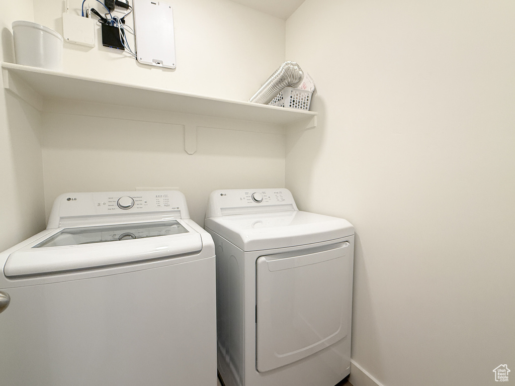 Laundry area with laundry area and washer and clothes dryer