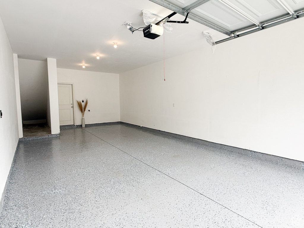 Garage featuring a garage door opener