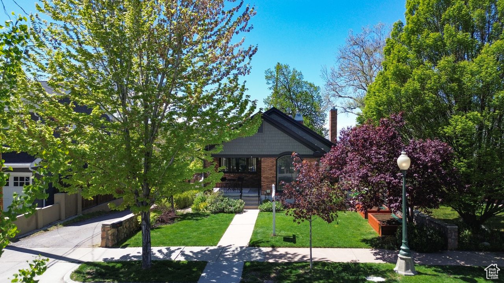 View of community featuring a lawn