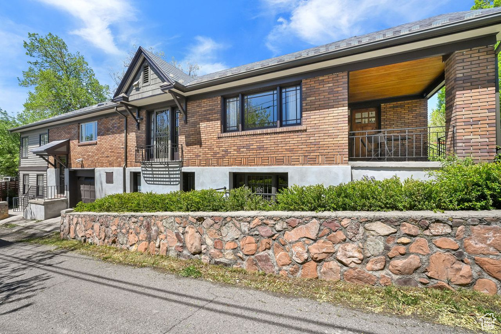 View of front of house featuring brick siding
