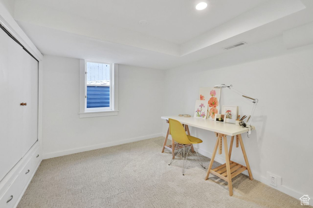 Home office featuring visible vents, carpet flooring, and baseboards