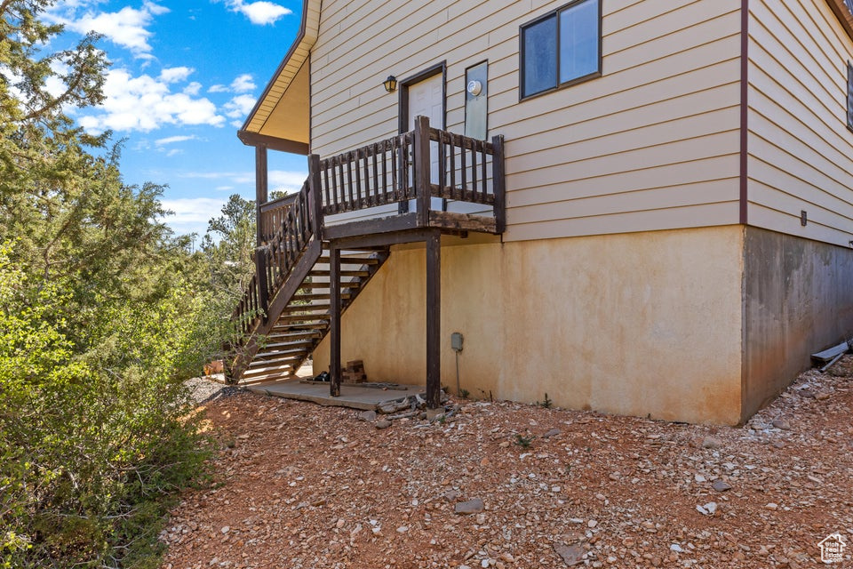 View of property exterior featuring stairs