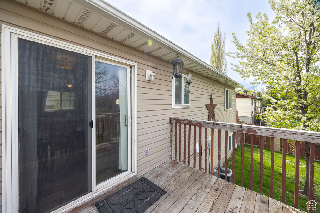 Wooden deck with a yard and cooling unit