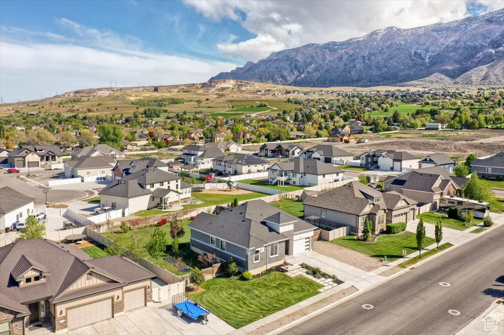 Birds eye view of property featuring a mountain view and a residential view