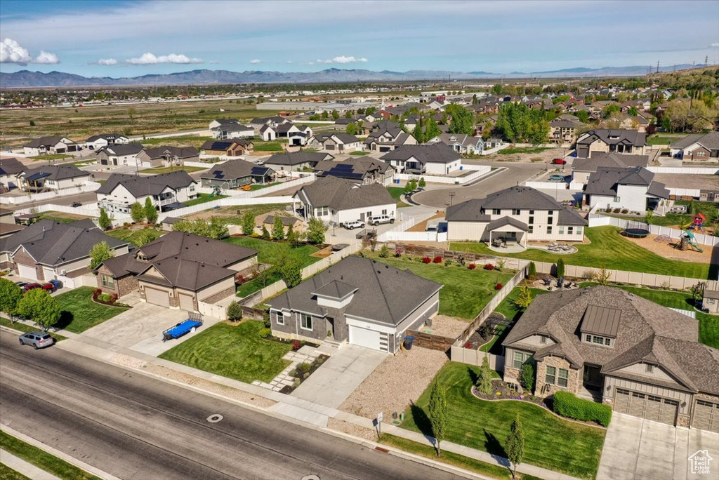 Birds eye view of property with a residential view and a mountain view