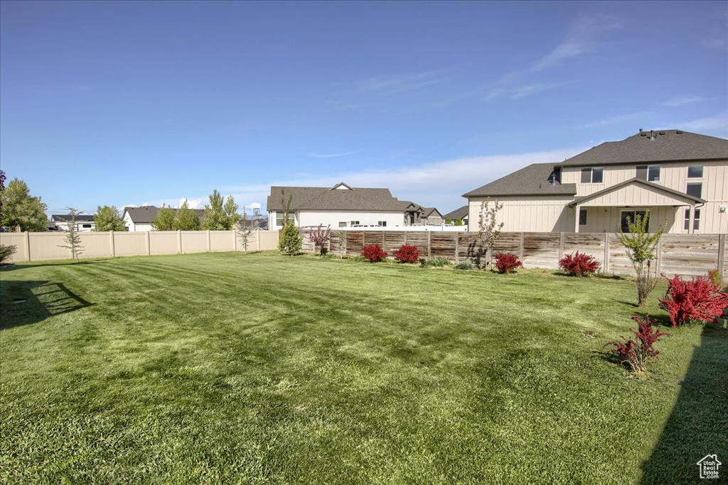 View of yard featuring fence