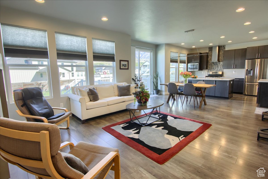 Living room with recessed lighting and wood finished floors