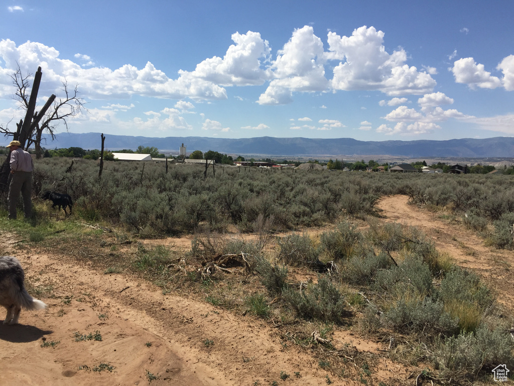 Property view of mountains with a rural view