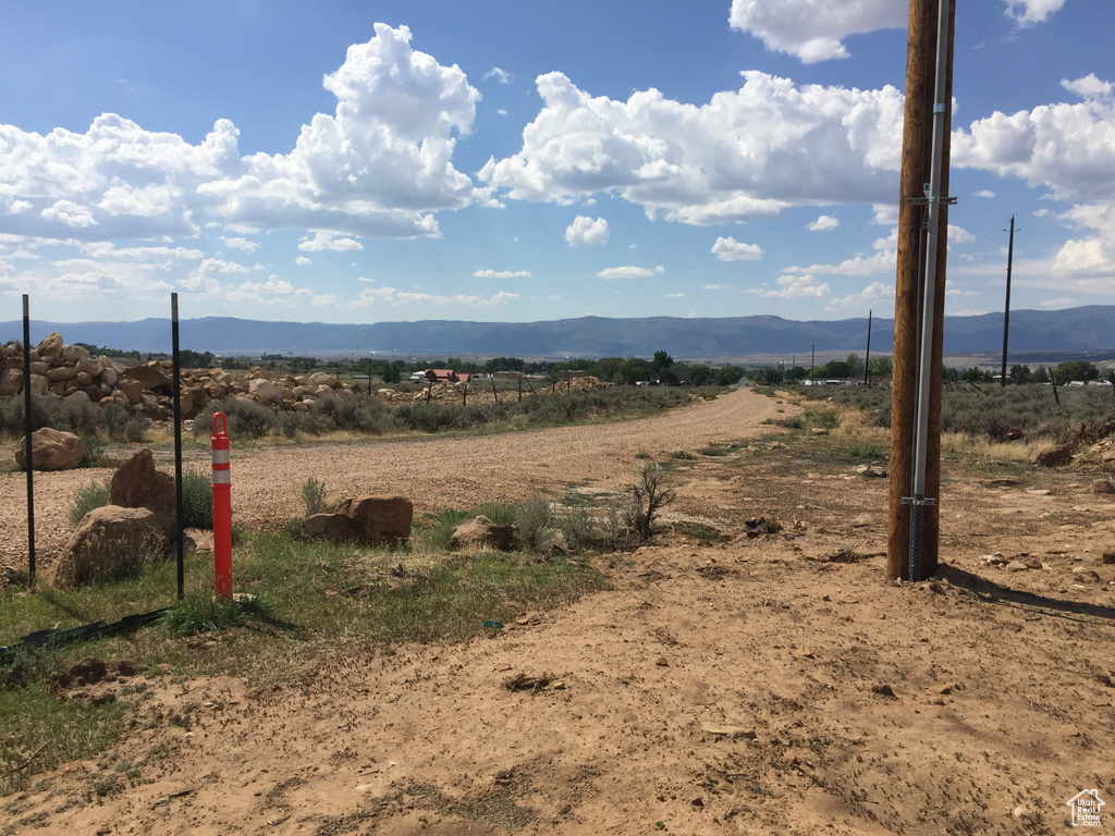Property view of mountains with a rural view