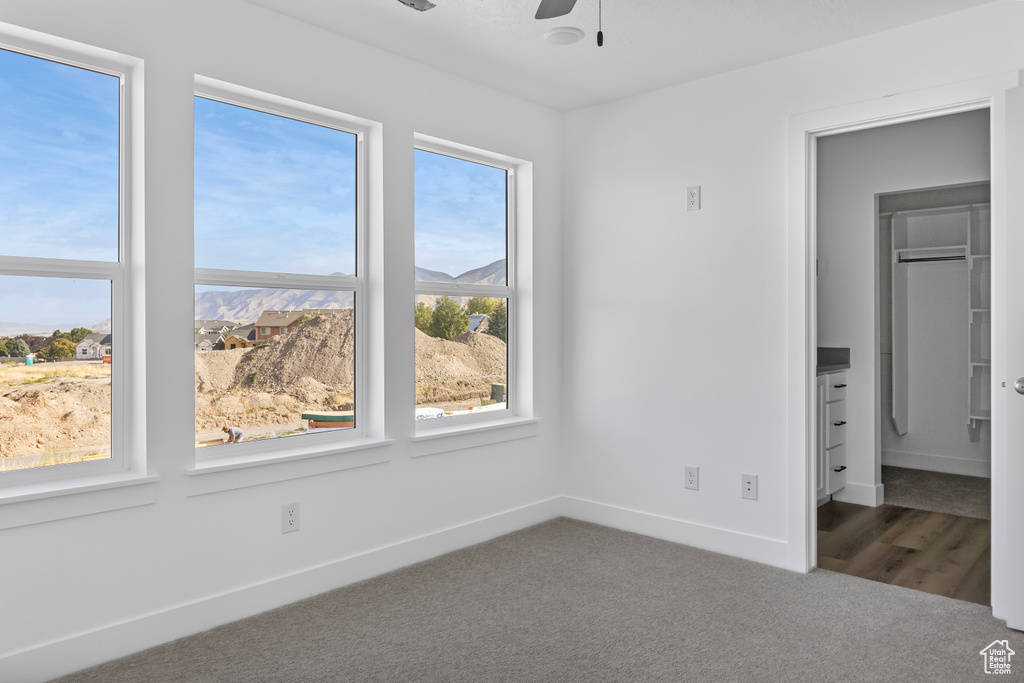 Unfurnished bedroom featuring carpet and baseboards