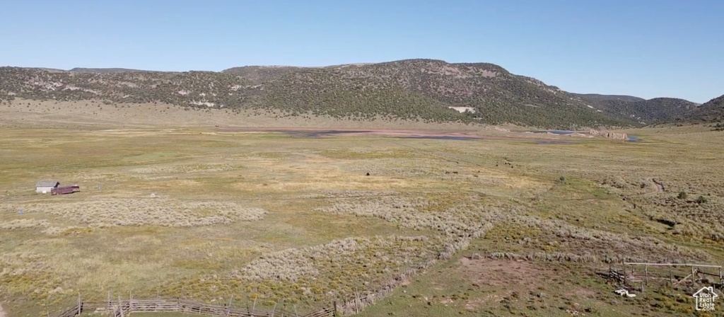 Property view of mountains with a rural view