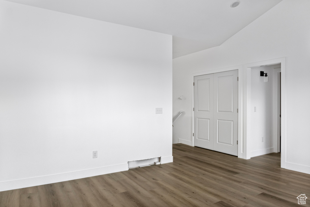 Empty room with baseboards and wood finished floors
