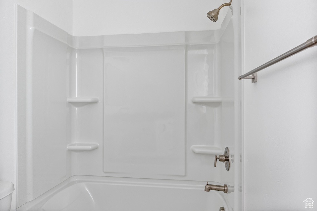Bathroom with toilet and tub / shower combination