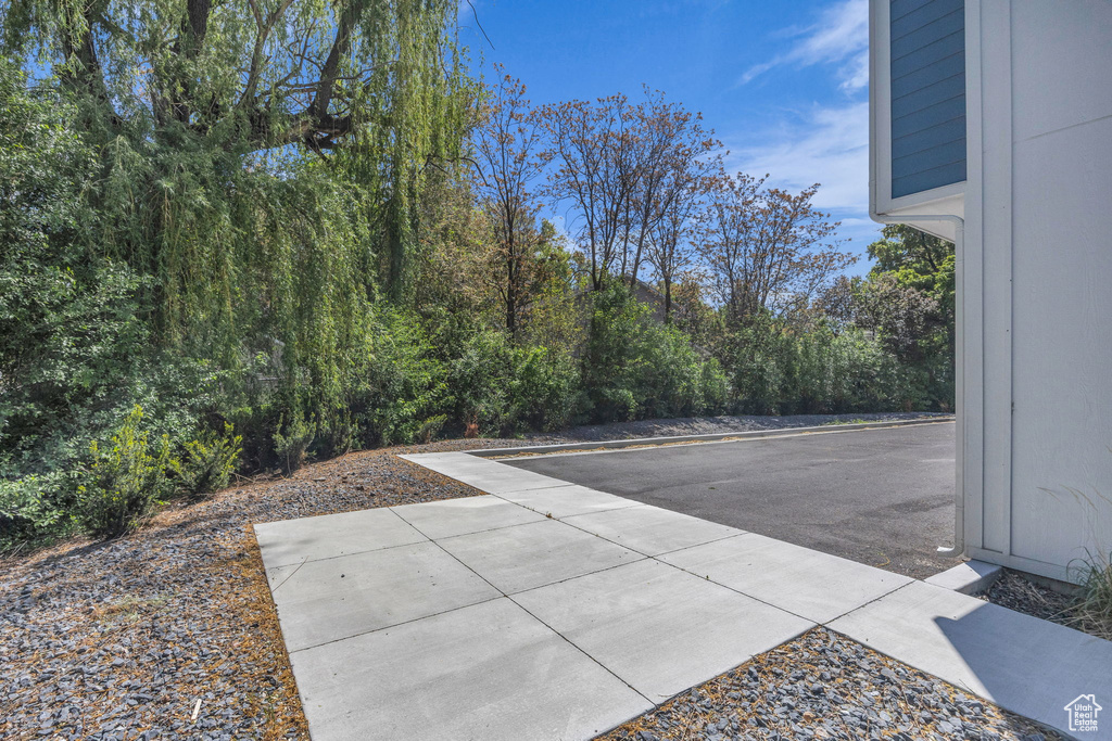 View of patio with a wooded view