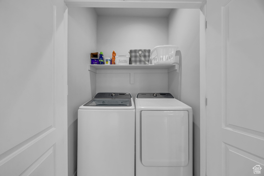Laundry room featuring separate washer and dryer and laundry area