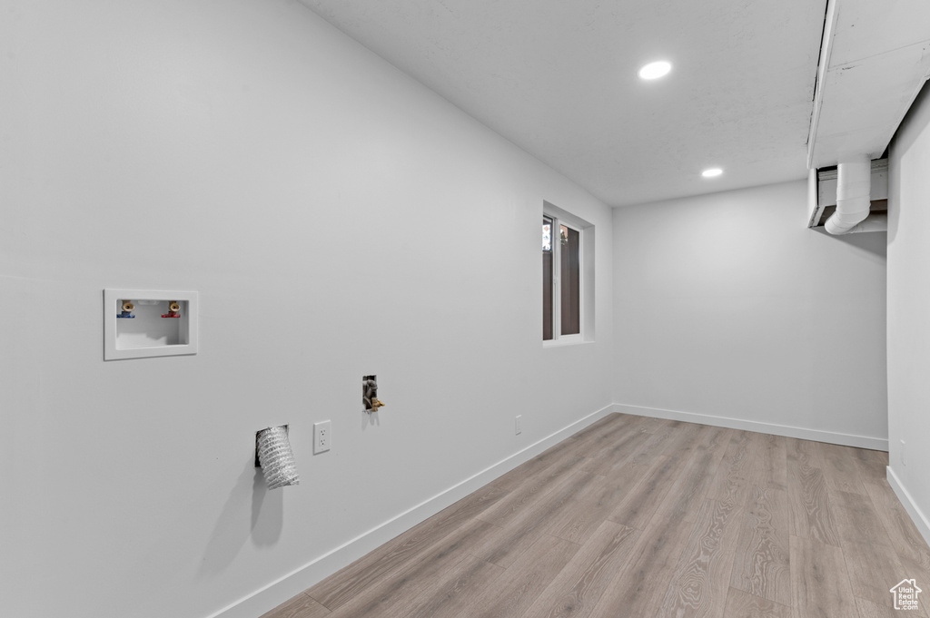 Laundry area with baseboards, light wood-type flooring, recessed lighting, and hookup for a washing machine